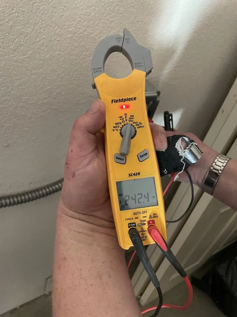 Voltage testing with clamp meter during Electrical Installation Services in Dock Junction